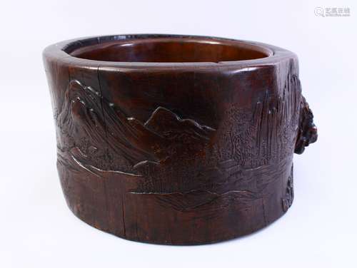 A GOOD LARGE JAPANESE CARVED AND LINED HARDWOOD PLANTER, the naturalistic piece carved to depict