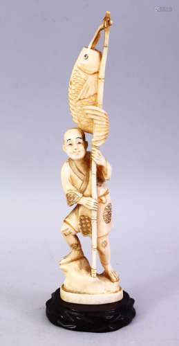 A JAPANESE MEIJI PERIOD CARVED IVORY OKIMONO - FISHERMAN, The man stood holding his rod and catch,