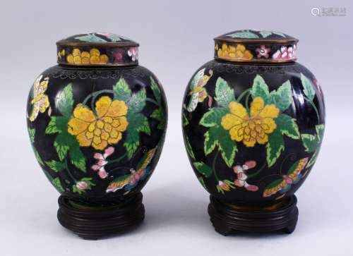 A GOOD PAIR OF 19TH / 20TH CENTURY CHINESE CLOISONNE JARS, COVERS & STANDS, the jard with a black