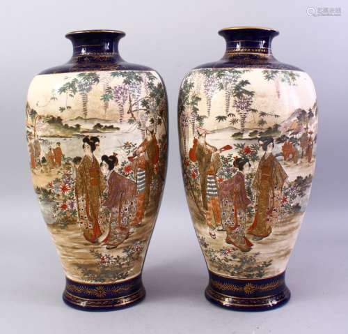 A LARGE PAIR OF JAPANESE LATE MEIJI PERIOD SATSUMA VASES, decorated with panels upon a blue ground