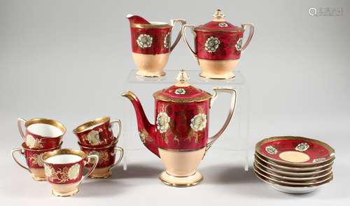 A NORITAKE COFFEE SERVICE, red and pink ground with gilded floral decoration and border,