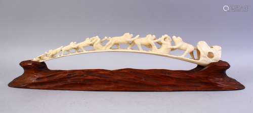 A JAPANESE MEIJI PERIOD CARVED MONKEY BRIDGE GROUP & STAND, the carved monkey group of varying