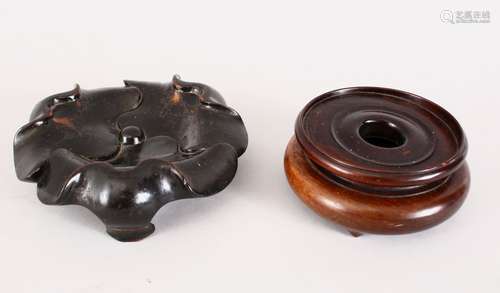 TWO GOOD CHINESE 19TH CENTURY HARDWOOD STANDS, one in the form of a lotus, 15.5cm, the other