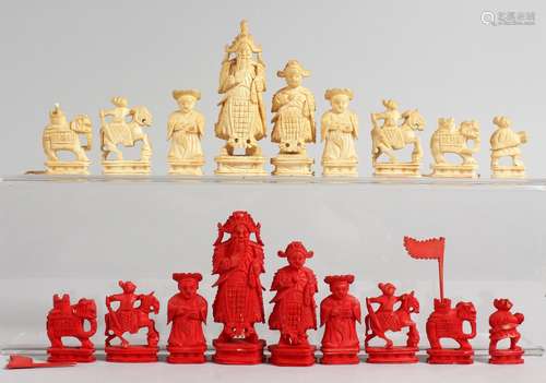 AN EARLY 20TH CENTURY CARVED AND STAINED IVORY MINIATURE CHINESE CHESS SET. 1.75ins high and