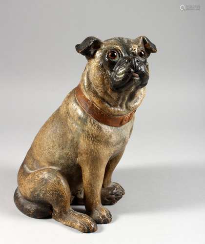 AN AUSTRIAN TERRACOTTA SEATED PUG DOG with glass eyes. 11ins high.