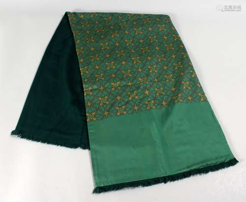 A HERMES SILK AND ANGORA GENTLEMEN'S SCARF, green ground with interlinked buckle design.