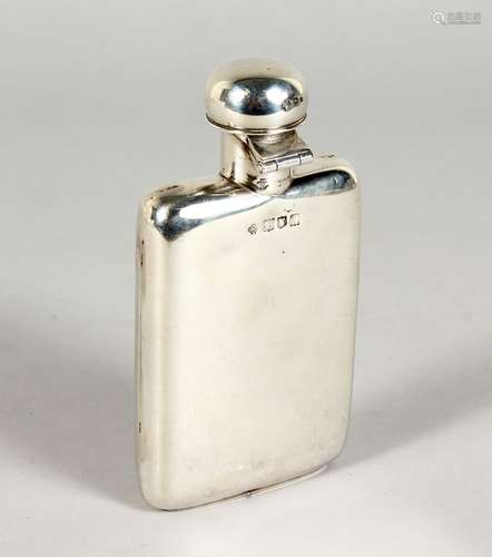 A GOOD, SMALL SILVER HIP FLASK, with unusual captive top. London 1908. 4.75ins high.