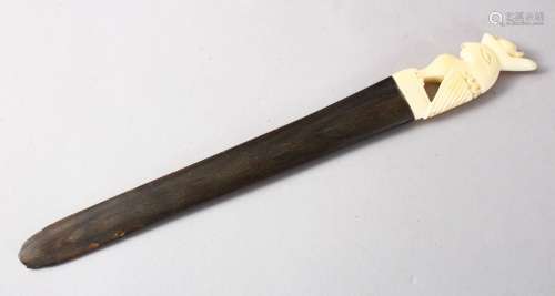 AN EASTERN 19TH CENTURY IVORY AND RHINO HORN PAGE TURNER, 25cm.