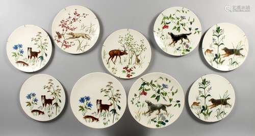 A DOULTON DESSERT SERVICE, painted with dogs, comprising two tazzas, seven plates.