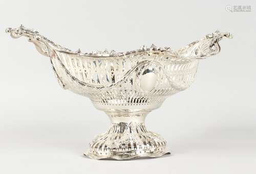 A MATCHING SMALL CLASSICAL OVAL PIERCED BASKET, hung with swags and motifs. 13ins long x 7ins