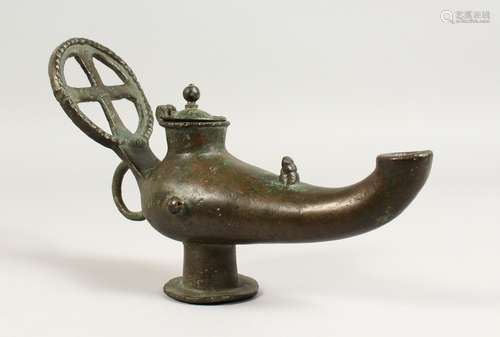 A LARGE BYZANTINE LIDDED BRONZE LAMP with Cruciform handle. 10ins long.`