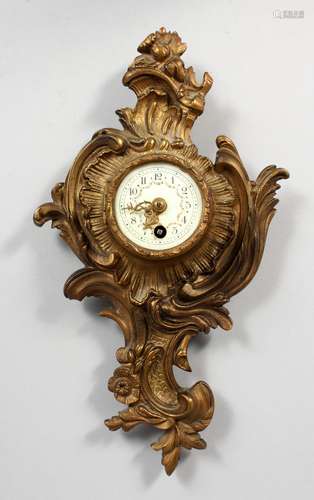 A SMALL 19TH CENTURY CONTINENTAL GILT BRONZE WALL CLOCK, with enamelled porcelain dial. 9.75ins