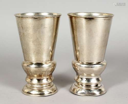 A PAIR OF CHINESE SILVER GOBLETS, stamped sterling C. J. Co. 5.25ins high.