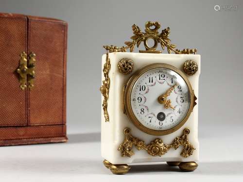 A GOOD LOUIS XVI DESIGN WHITE MARBLE CLOCK, with ormolu mounts. 5.5ins high, in a leather carrying