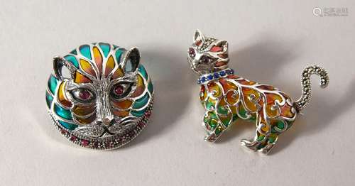 TWO SILVER, RUBY AND SAPPHIRE SET CAT BROOCHES.