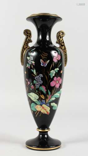 A VICTORIAN BLACK GLASS TWO-HANDLED VASE, painted with flowers and butterflies. 12ins high.
