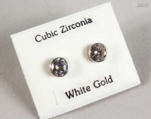 A PAIR OF 9CT GOLD CZ STUD EARRINGS.