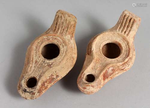 TWO SMALL TERRACOTTA OIL LAMPS.