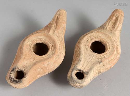 TWO SMALL TERRACOTTA OIL LAMPS.