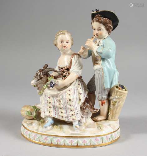 A GOOD MEISSEN PORCELAIN GROUP OF A YOUNG BOY AND GIRL, the boy playing a pipe, the girl seated with