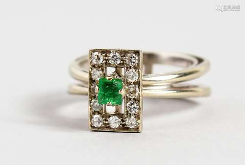 AN 18CT GOLD WHITE GOLD, EMERALD AND DIAMOND SET DESIGNER RING.