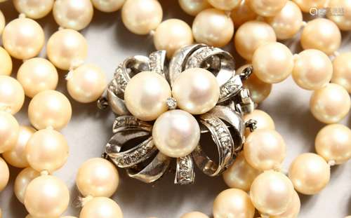 A GOOD TWO-ROW PEARL NECKLACE with white gold, diamond and pearl clasp.