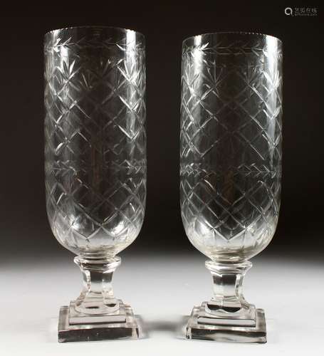 A PAIR OF LARGE CUT GLASS PEDESTAL STORM LANTERNS. 13.5ins.