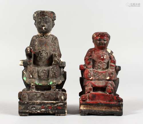 TWO SMALL CHINESE CARVED WOOD AND PAINTED SEATED FIGURES. 4.25ins and 5.5ins high.