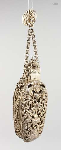 A CHINESE WHITE METAL PIERCED PERFUME BOTTLE. 4ins high.