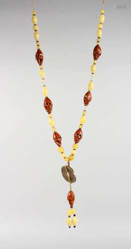 AN UNUSUAL CHINESE CARVED NUT, COLOURED BEAD AND BRONZE NECKLACE. 24ins long.