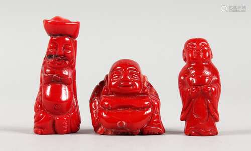 THREE CHINESE CARVED CORAL FIGURES. 1.5ins, 2ins and 2.25ins high.