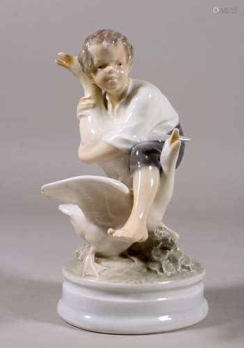 A COPENHAGEN PORCELAIN GROUP ON A YOUNG BOY WITH TWO GEESE. Pattern No. 2139. 7ins high.