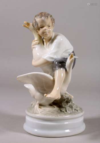 A COPENHAGEN PORCELAIN GROUP ON A YOUNG BOY WITH TWO GEESE. Pattern No. 2139. 7ins high.
