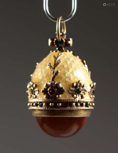 A RUSSIAN SILVER AND ENAMEL MINIATURE EGG PENDANT. 0.75ins high.