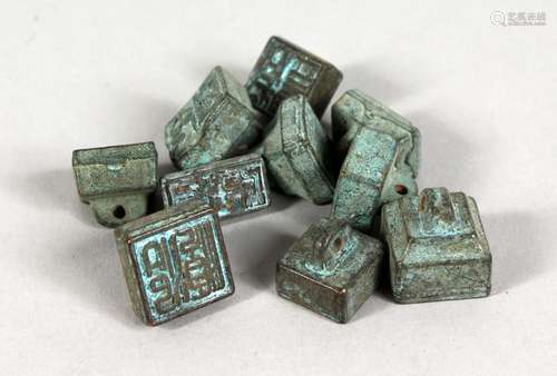 A SET OF TEN CHINESE BRONZE MINIATURE SEALS. 0.5ins wide.