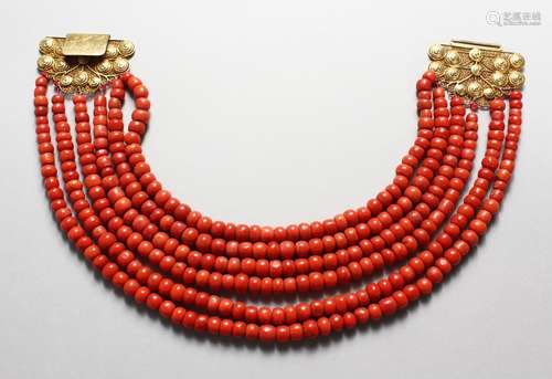 A GOOD SIX STRAND CORAL BEAD NECKLACE, with 18ct gold filigree clasp.