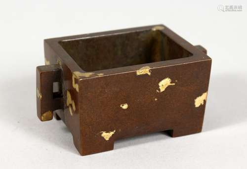 A CHINESE MINIATURE RECTANGULAR GOLD SPLASH BRONZE CENSER. 2.75ins long.