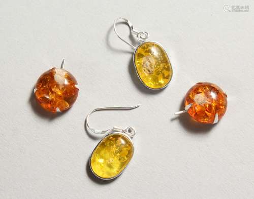 TWO PAIRS OF SILVER AND AMBER EARRINGS.