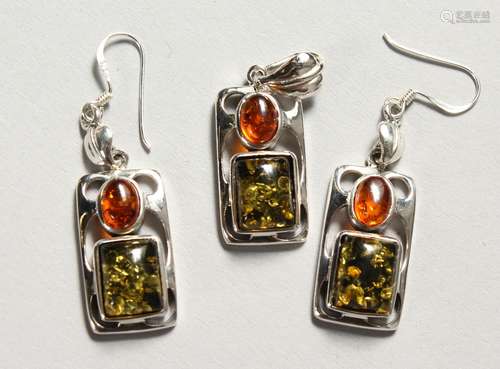 A PAIR OF SILVER AND AMBER EARRINGS, with matching pendant.