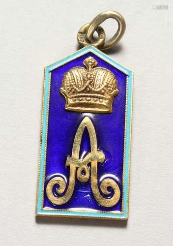 A RUSSIAN SILVER PENDANT, enamel decorated with a crown and letter 