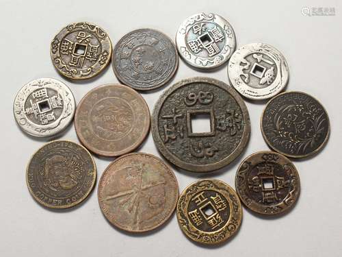 TWELVE ASSORTED CHINESE COINS.