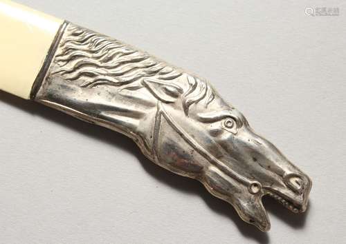 A SILVER HORSE HEAD MOUNTED PAGE TURNER. 10.25ins long.