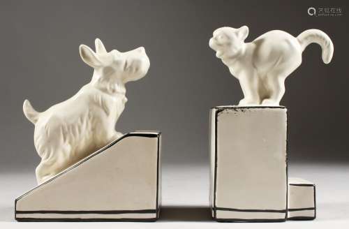 A PAIR OF CREAMWARE PORCELAIN BOOKENDS, DOG AND CAT. 6ins.
