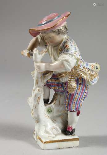 A SMALL MEISSEN PORCELAIN FIGURE OF A YOUNG BOY cutting a stick. Cross swords mark in blue. 4ins