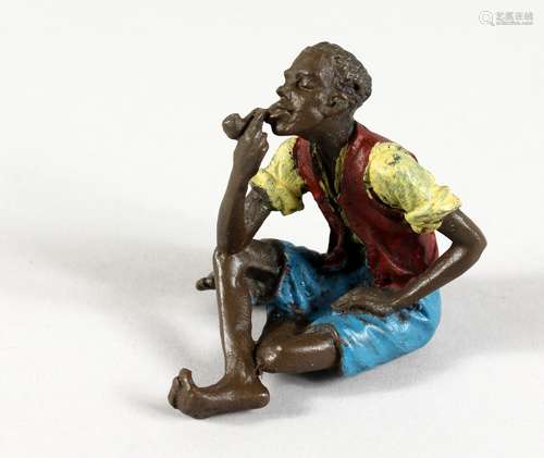 A VIENNA STYLE COLD PAINTED BRONZE OF A MAN SMOKING A PIPE. 2.25ins high.