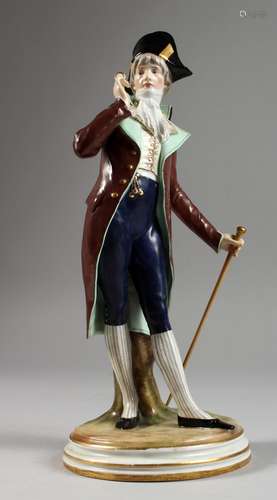 A MEISSEN PORCELAIN FIGURE OF A DANDY holding a glass and walking cane. Cross swords mark in blue.