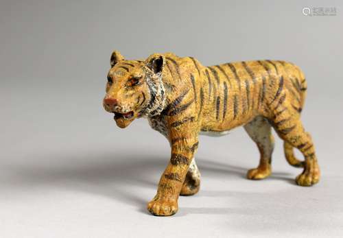 A VIENNA STYLE COLD PAINTED BRONZE OF A TIGER. 4ins long.