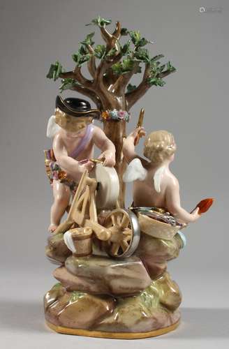 A MEISSEN PORCELAIN GROUP OF THE INFANT CUPID AND PSYCHE beneath a tree, cupid sharpening an