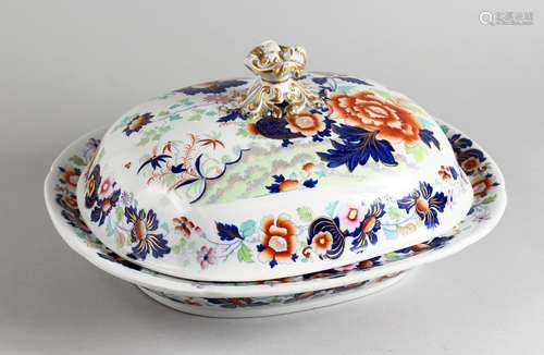 A GOOD LARGE 19TH CENTURY IRONSTONE DISH AND COVER, decorated in the Imari colours. 16.5ins wide.