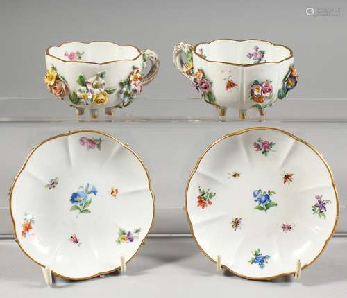 A GOOD PAIR OF MEISSEN FLOWER ENCRUSTED CUPS AND SAUCERS painted with insects. Cross swords mark